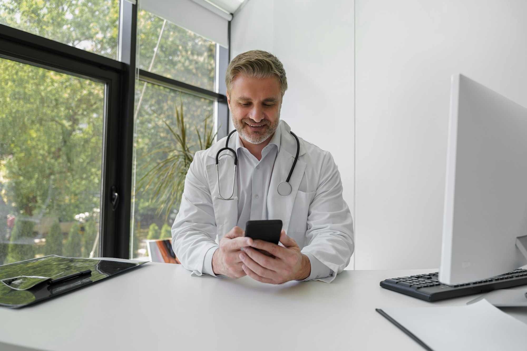 Professional doctor holding in hands phone and chatting with patient. Medicine online concept