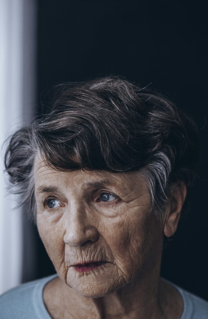 Old grandmother's face with wrinkles